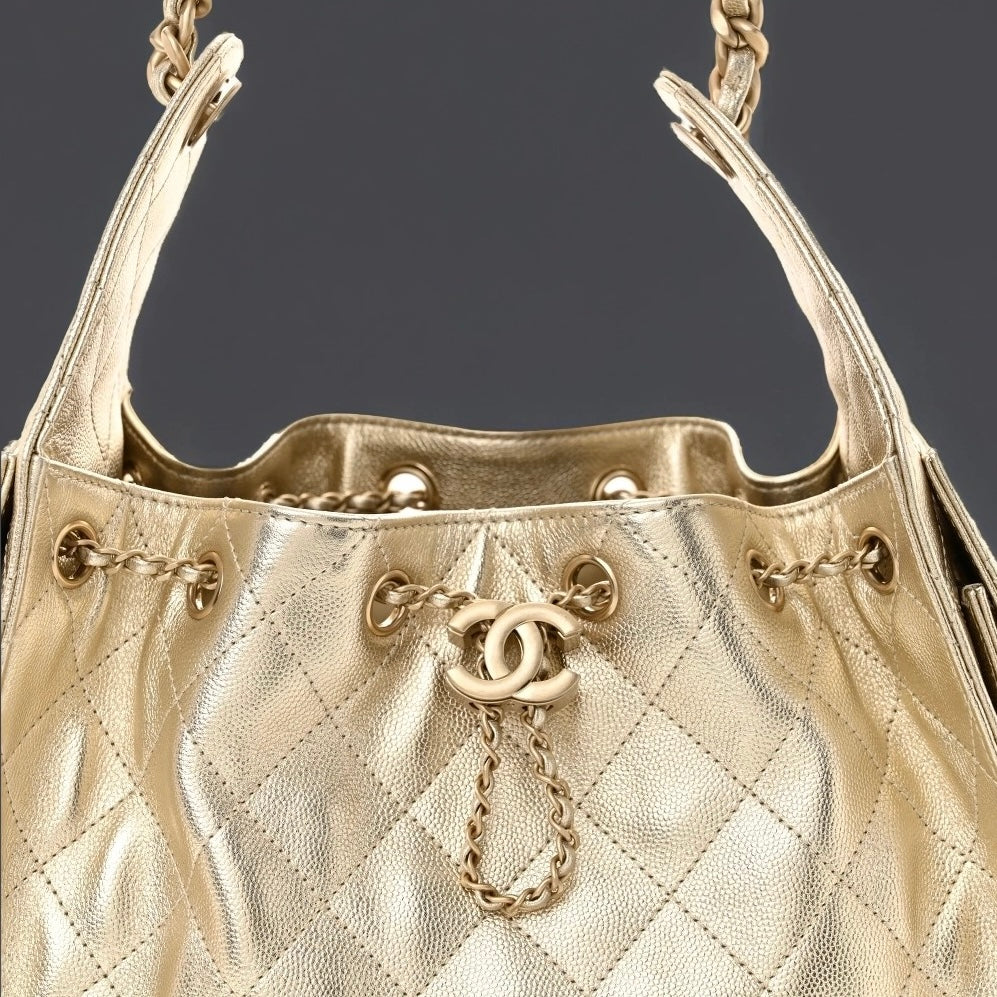 Metallic Caviar Quilted Small Chanel 25 Handbag Gold